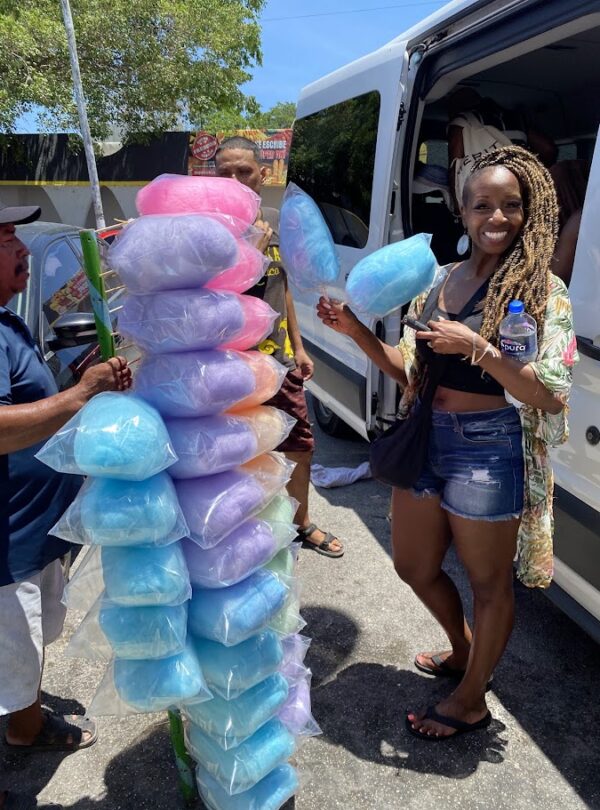 Traveler buying cotton candy at Mercado 23 local market in Cancun