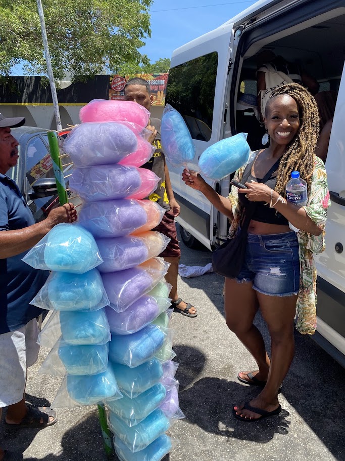 Traveler buying cotton candy at Mercado 23 local market in Cancun