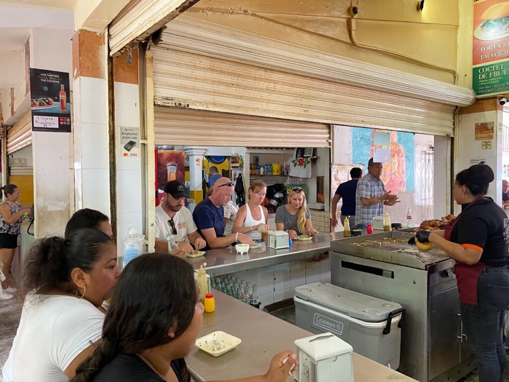 Local food stalls inside Mercado 23 Cancun traditional market