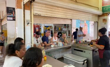 Local food stalls inside Mercado 23 Cancun traditional market
