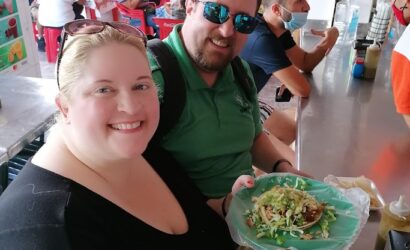 People enjoying food at market.