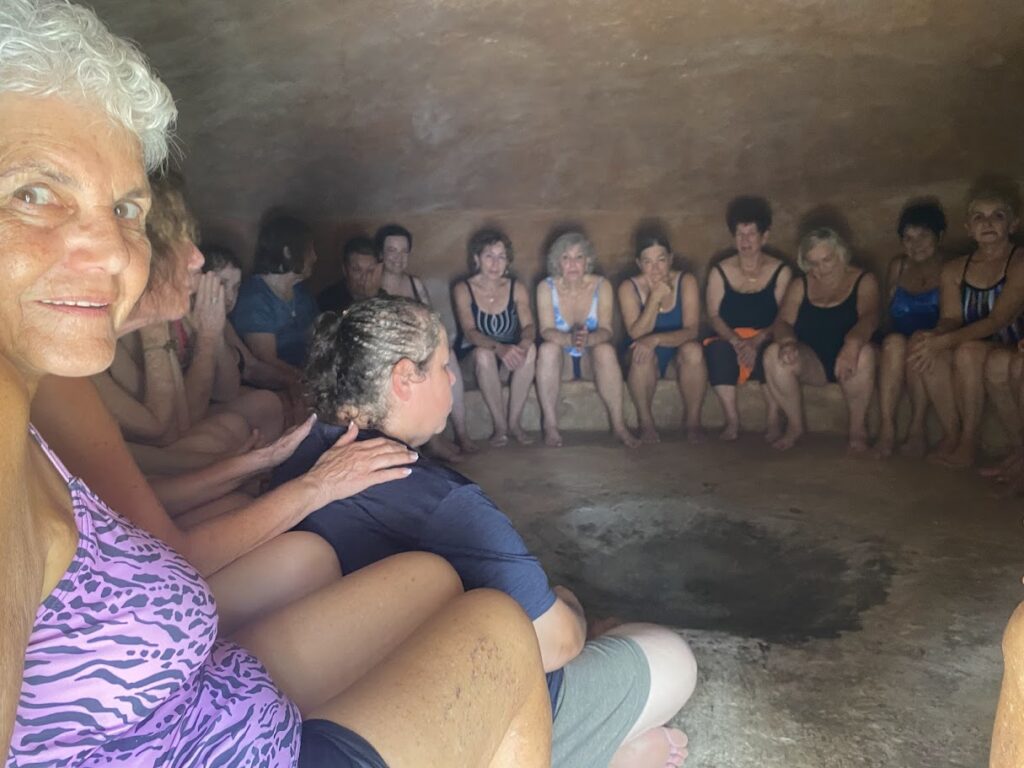Group of women inside temazcal before ceremony in Mayan community