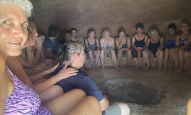 Group of women inside temazcal before ceremony in Mayan community